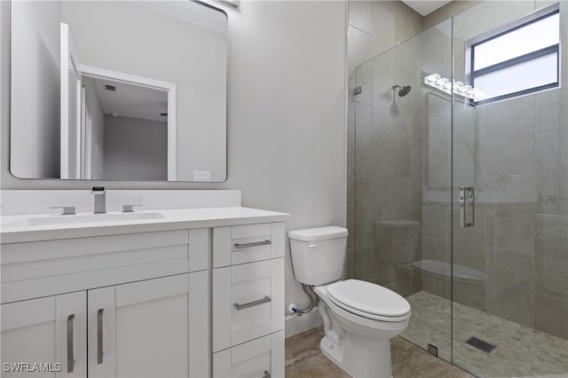 full bath featuring visible vents, baseboards, toilet, vanity, and a shower stall