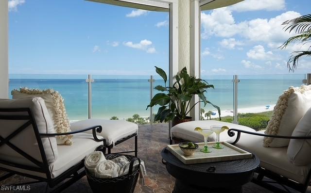 balcony featuring a water view