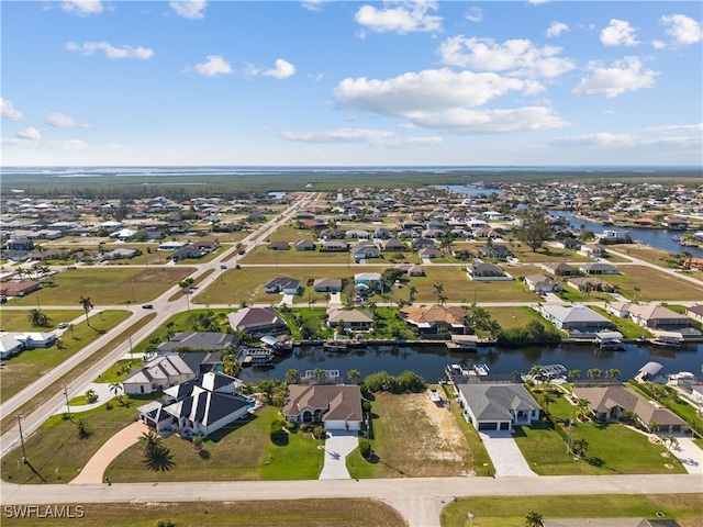 aerial view featuring a water view and a residential view