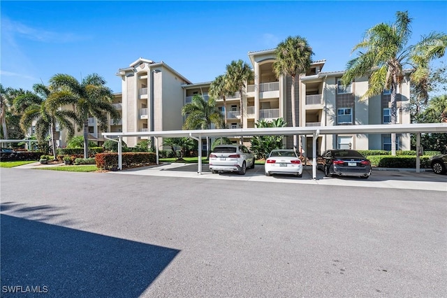 view of property with covered parking