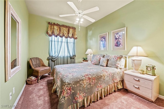 carpeted bedroom featuring ceiling fan and baseboards