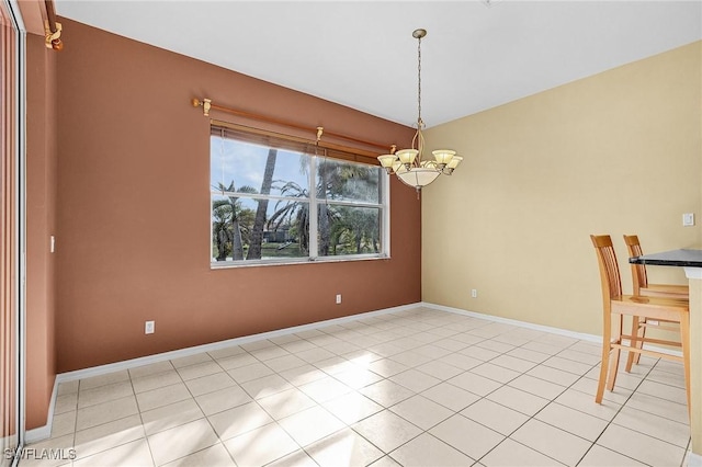 3266 Sturgeon Bay Ct, Naples, FL 34120 - unfurnished dining area featuring baseboards, tile patterned floors, and an inviting chandelier