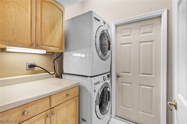 3266 Sturgeon Bay Ct, Naples, FL 34120 - washroom with cabinet space and stacked washer / dryer