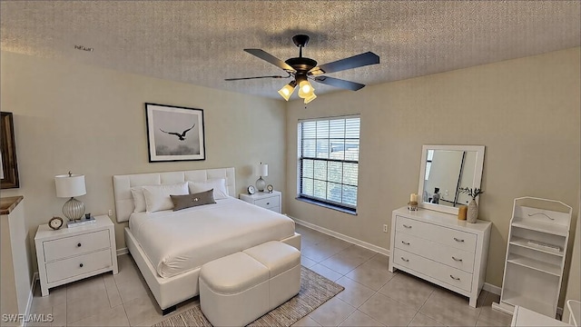 bedroom with light tile patterned floors, visible vents, and a textured ceiling