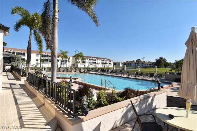 community pool featuring a residential view