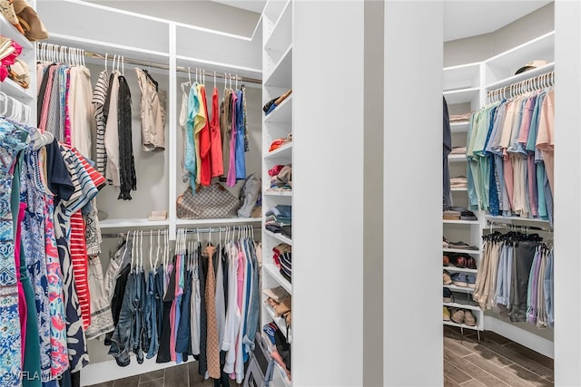 spacious closet featuring wood finish floors