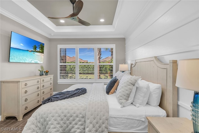 bedroom featuring recessed lighting, a ceiling fan, wood tiled floor, a raised ceiling, and crown molding