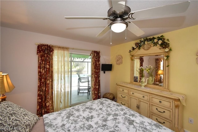 bedroom with access to outside and ceiling fan