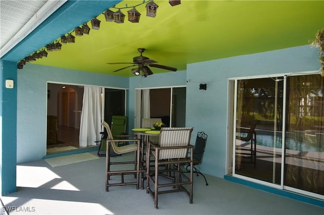 view of patio with ceiling fan and outdoor dining area