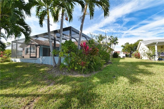 view of yard featuring a lanai