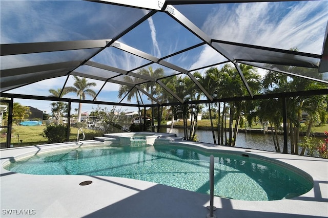 view of swimming pool featuring a pool with connected hot tub, a water view, a patio, and a lanai