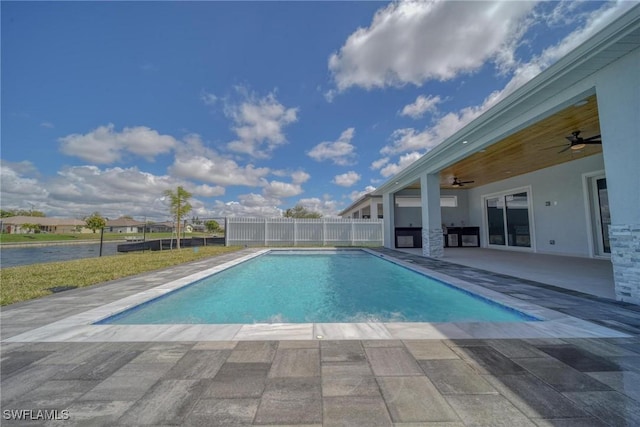 view of swimming pool featuring a fenced in pool, ceiling fan, a patio, and fence