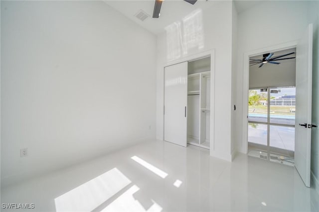 149 SE 21st St, Cape Coral, FL 33990 - unfurnished bedroom with a ceiling fan, visible vents, access to outside, and tile patterned flooring