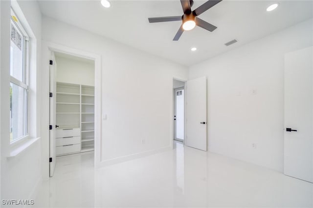 149 SE 21st St, Cape Coral, FL 33990 - unfurnished bedroom with ceiling fan, tile patterned floors, recessed lighting, a spacious closet, and visible vents