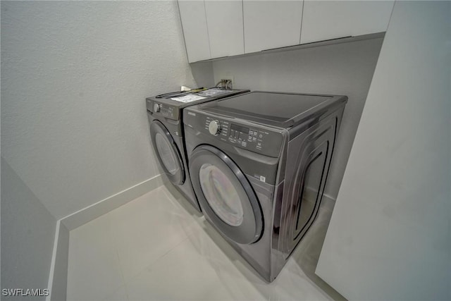 149 SE 21st St, Cape Coral, FL 33990 - laundry room with cabinet space and washer and dryer
