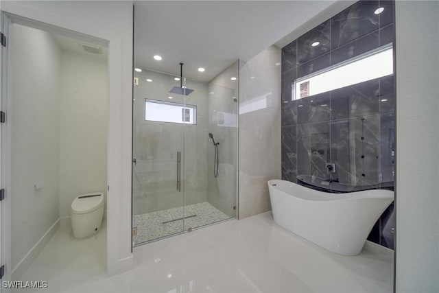 149 SE 21st St, Cape Coral, FL 33990 - full bathroom featuring a stall shower, a healthy amount of sunlight, toilet, and a soaking tub