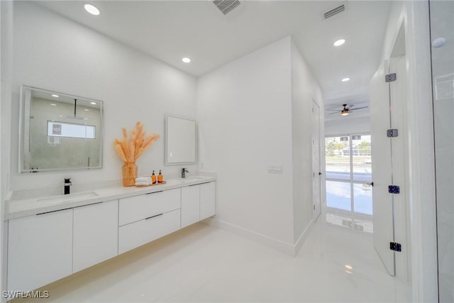 149 SE 21st St, Cape Coral, FL 33990 - bathroom with double vanity, baseboards, ceiling fan, recessed lighting, and a sink