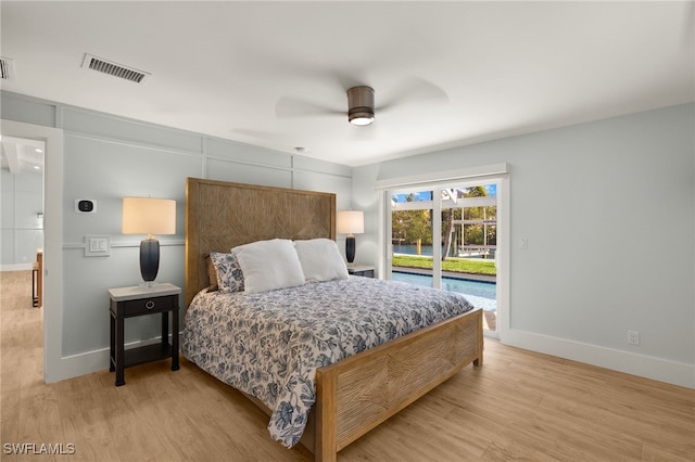 bedroom with access to outside, light wood-style flooring, visible vents, and baseboards