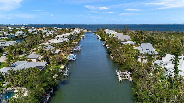 birds eye view of property featuring a residential view and a water view