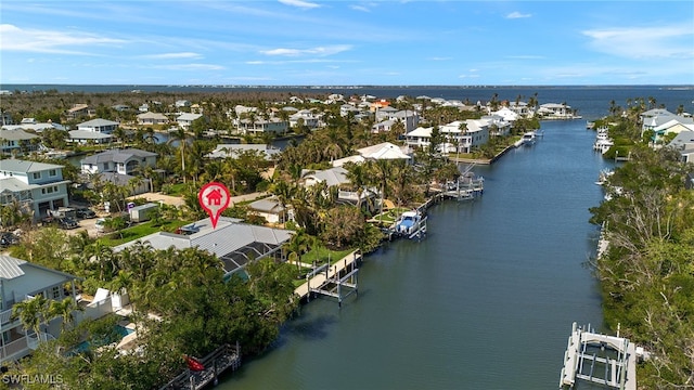 bird's eye view with a water view and a residential view