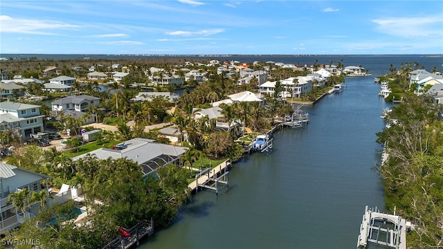 bird's eye view featuring a residential view and a water view