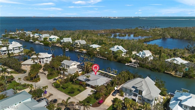 aerial view with a water view and a residential view