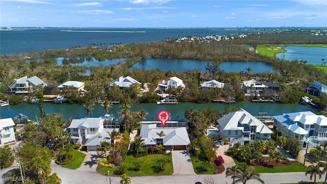 birds eye view of property with a residential view and a water view