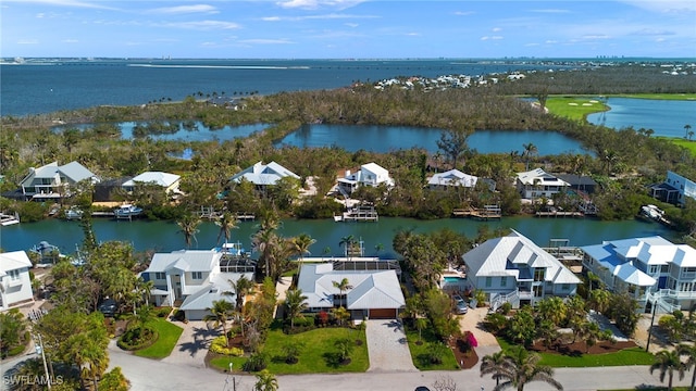 bird's eye view featuring a water view and a residential view