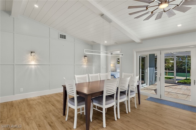 dining room with vaulted ceiling with beams, light wood-style flooring, visible vents, and ceiling fan