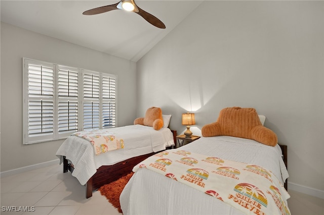 bedroom with lofted ceiling, ceiling fan, and baseboards