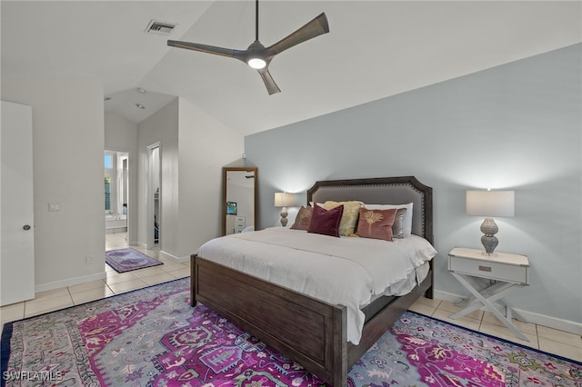 bedroom with lofted ceiling, baseboards, visible vents, and tile patterned floors