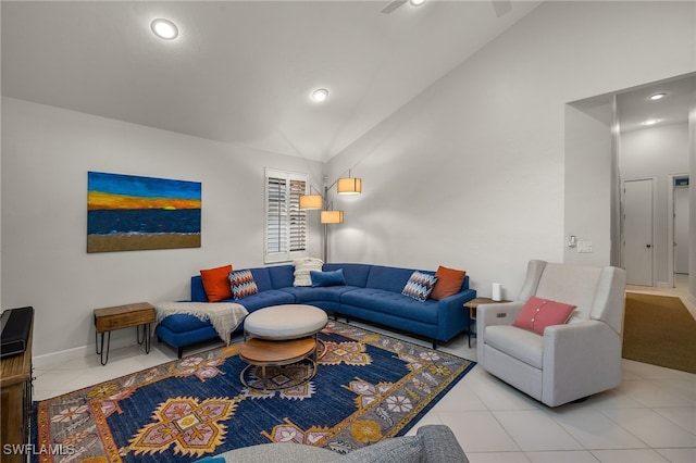 tiled living room featuring high vaulted ceiling, recessed lighting, and baseboards