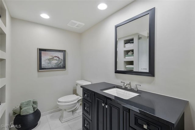 bathroom featuring recessed lighting, toilet, vanity, and tile patterned floors