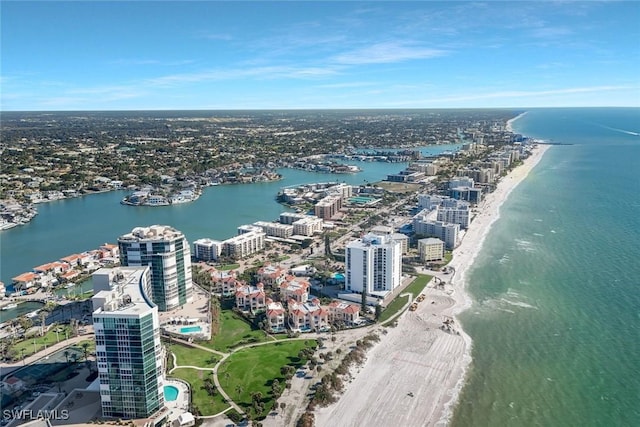 bird's eye view with a water view, a city view, and a view of the beach