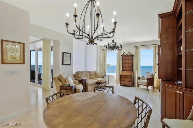970 Cape Marco Dr Unit 1107, Marco Island, FL 34145 - dining room featuring a notable chandelier and baseboards