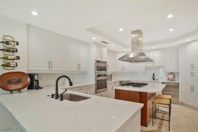 970 Cape Marco Dr Unit 1107, Marco Island, FL 34145 - kitchen with stainless steel appliances, a breakfast bar, a sink, and island range hood