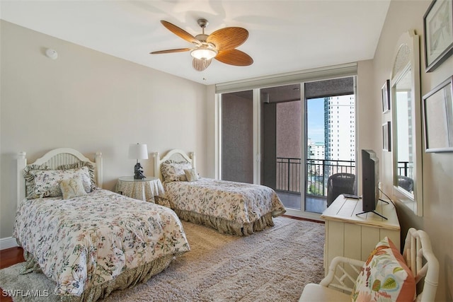 970 Cape Marco Dr Unit 1107, Marco Island, FL 34145 - bedroom with access to exterior, ceiling fan, expansive windows, and wood finished floors