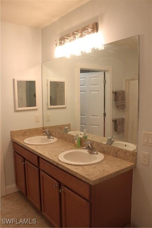 bathroom with double vanity and a sink