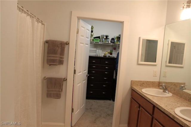 bathroom featuring double vanity and a sink