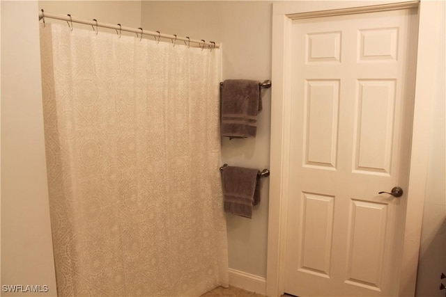 bathroom featuring baseboards