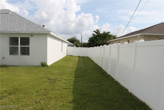 view of yard with a fenced backyard