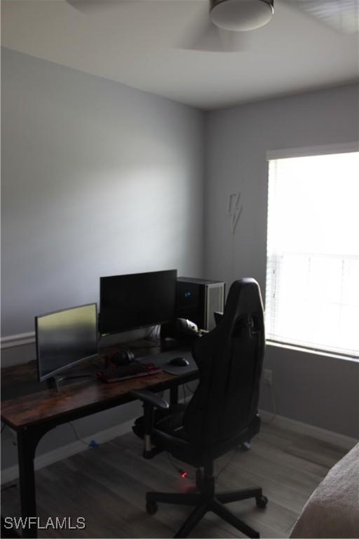 office featuring baseboards and wood finished floors