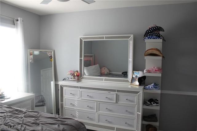 bedroom featuring multiple windows and ceiling fan