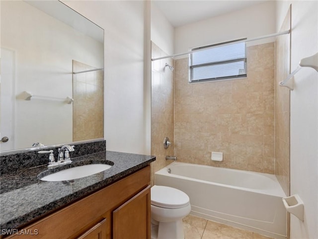 full bath with  shower combination, tile patterned flooring, vanity, and toilet