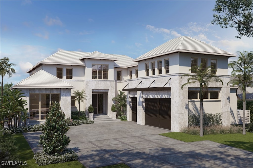 contemporary house with stucco siding, a garage, and driveway