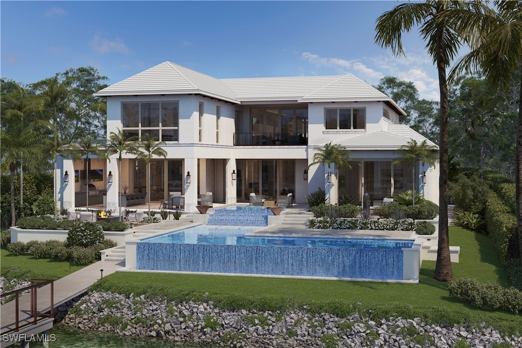 back of property featuring a patio, a lawn, an infinity pool, and stucco siding