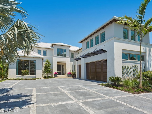 3233 Gin Ln, Naples, FL 34102 - contemporary home with stucco siding