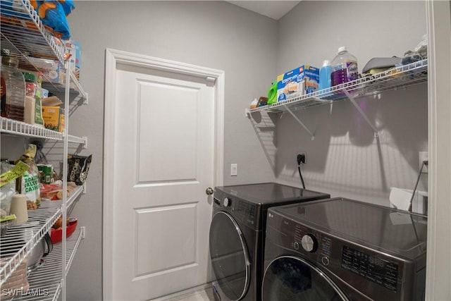 laundry area with laundry area and washing machine and clothes dryer