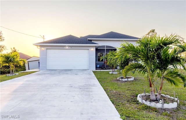 view of front of home featuring a garage, a shingled roof, concrete driveway, and stucco siding