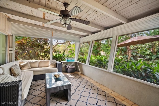 sunroom / solarium with wood ceiling, beam ceiling, and a ceiling fan